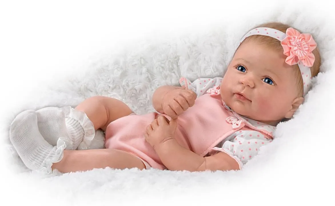 The Ashton - Drake Galleries Ava Lifelike TrueTouch® Authentic Silicone Baby Girl Doll with Hand Rooted Hair and Pink Jumper Weighted for Realism Fully Poseable by Master Doll Artist Linda Murray 18"-Inches