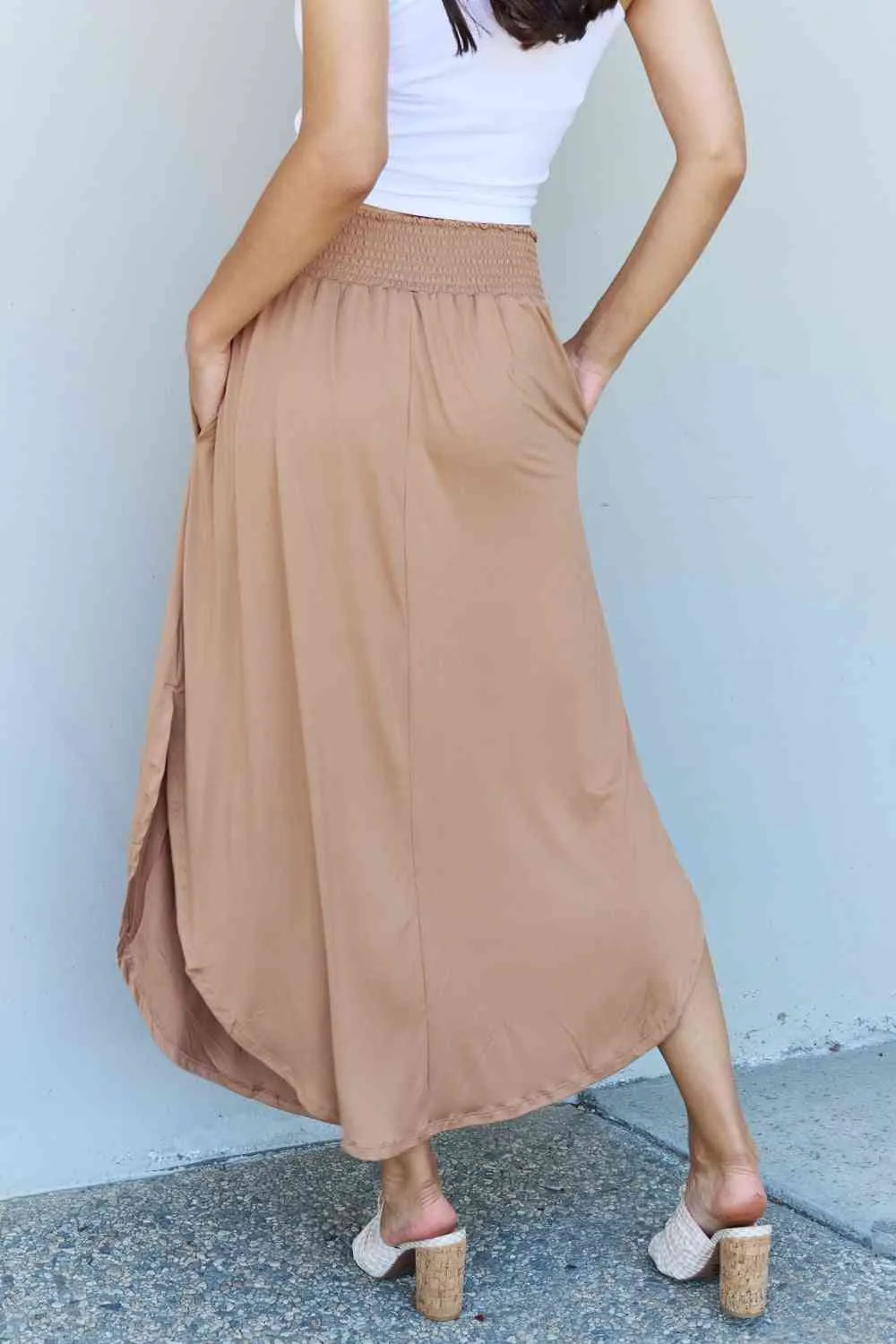 The Nina High Waist Scoop Hem Maxi Skirt in Tan