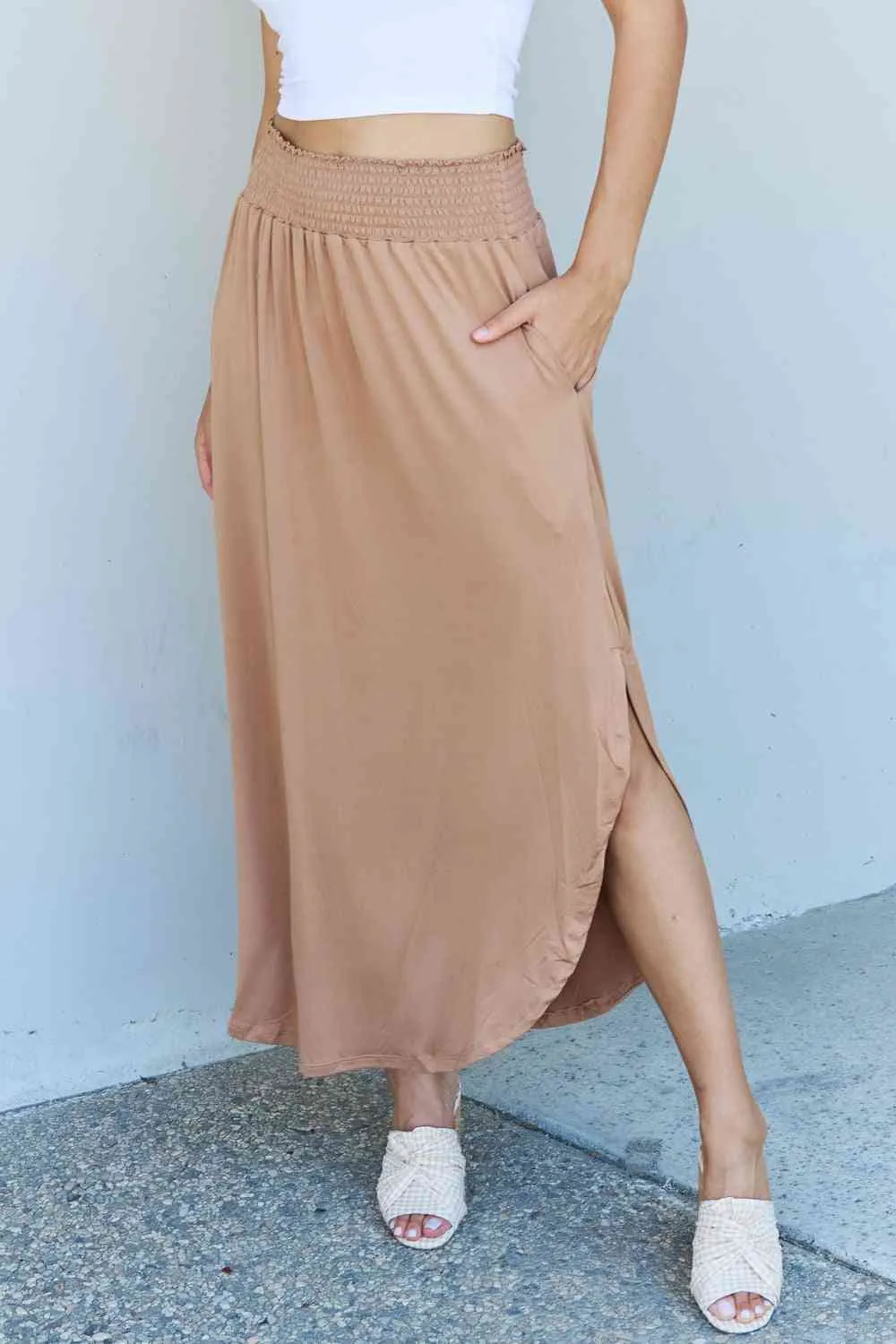 The Nina High Waist Scoop Hem Maxi Skirt in Tan