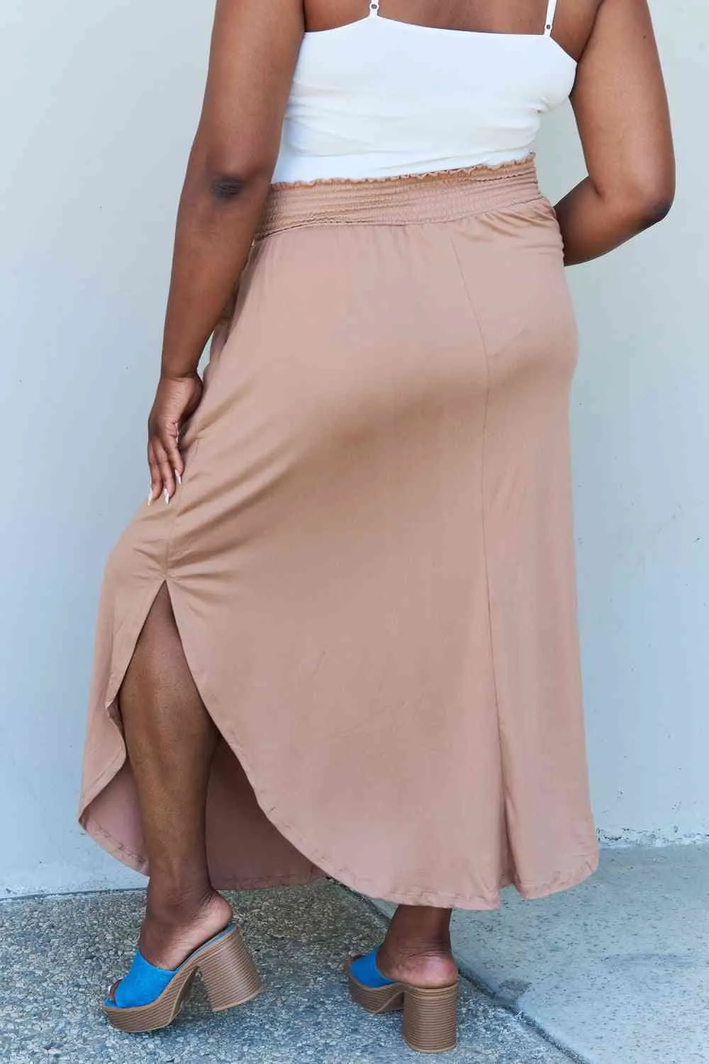 The Nina High Waist Scoop Hem Maxi Skirt in Tan