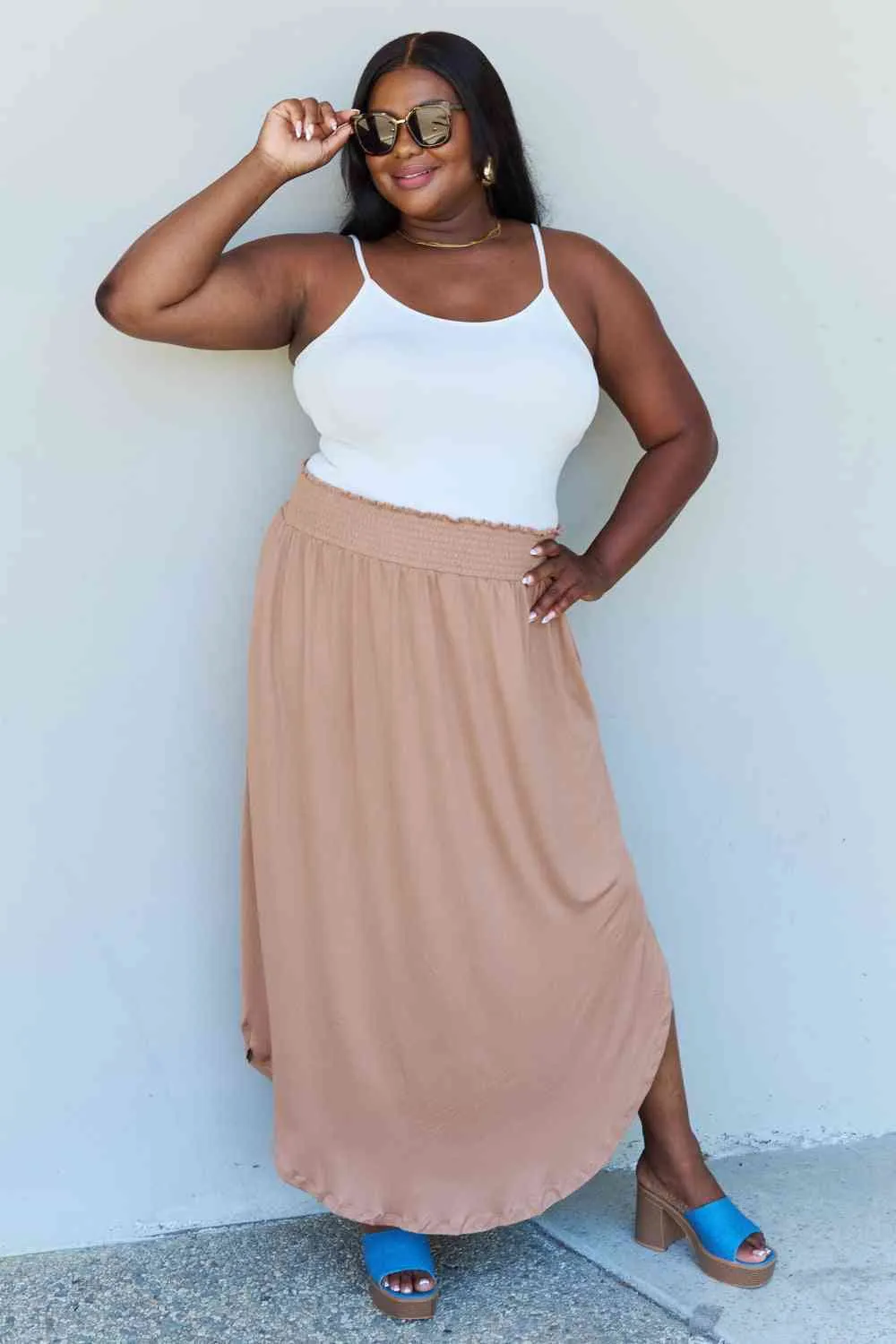 The Nina High Waist Scoop Hem Maxi Skirt in Tan