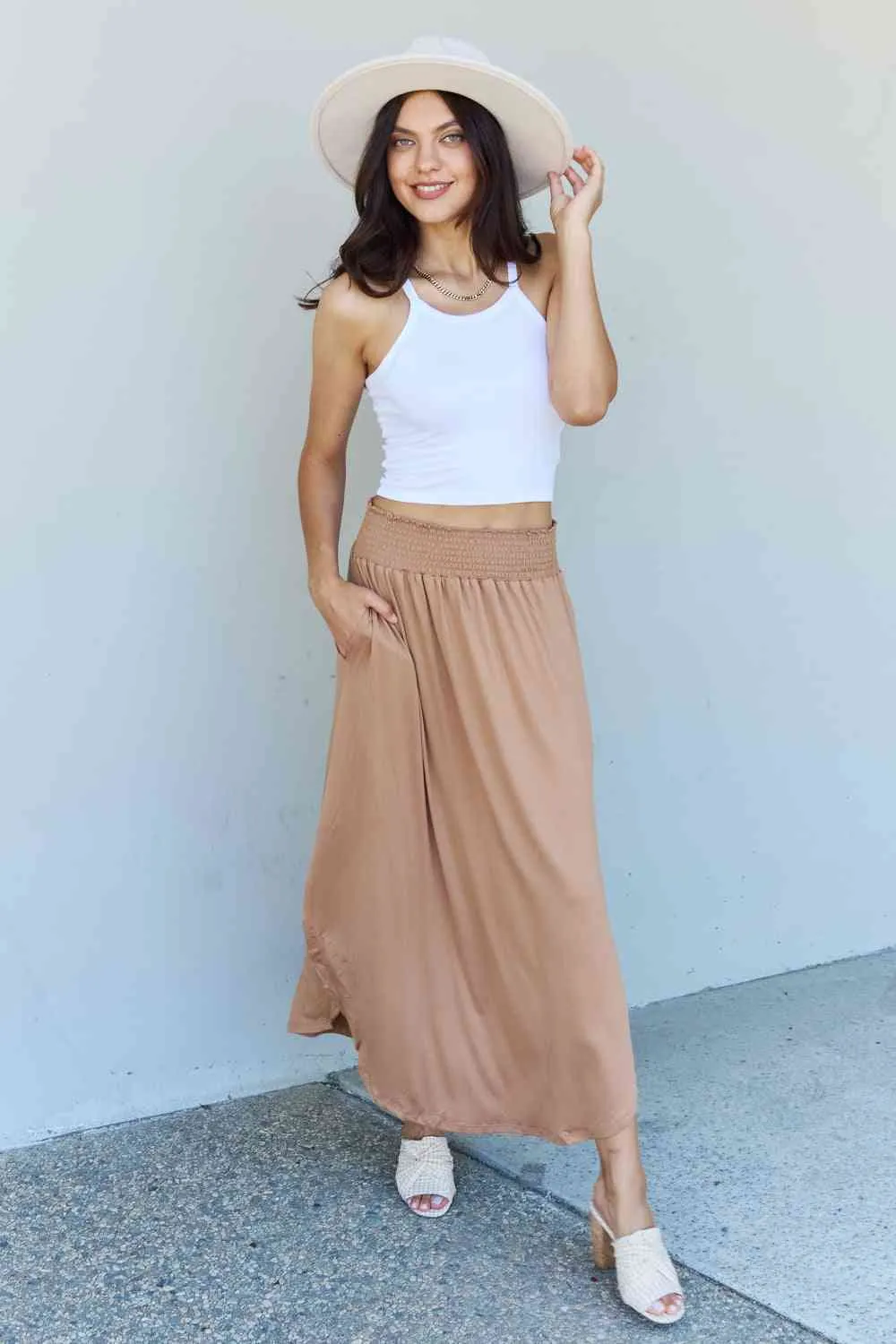 The Nina High Waist Scoop Hem Maxi Skirt in Tan