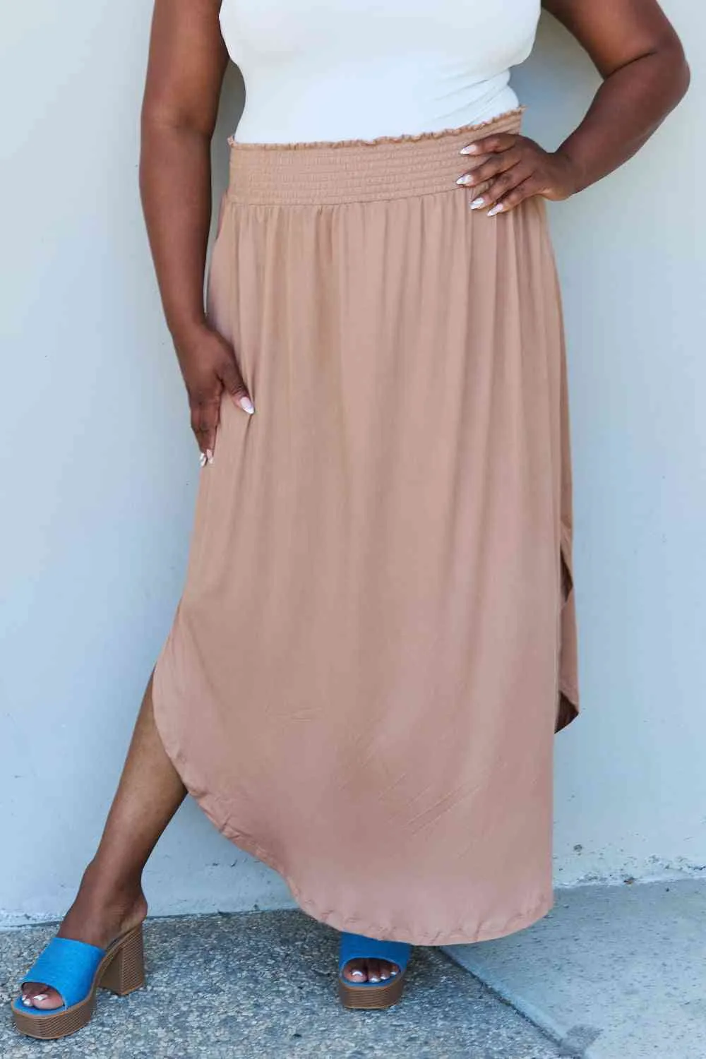 The Nina High Waist Scoop Hem Maxi Skirt in Tan